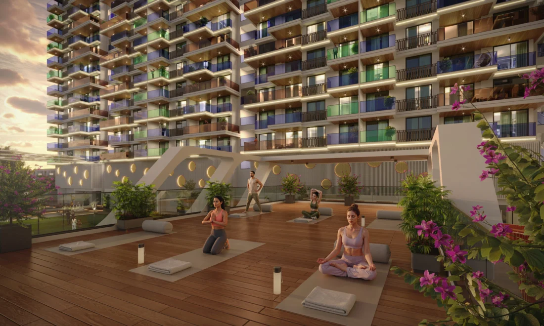 Residents practising yoga on the open-air deck at Swagat Bellazio at dusk